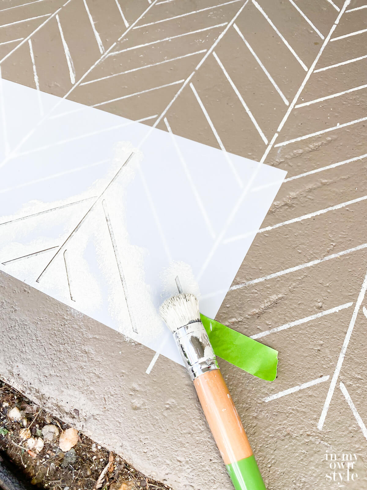 How to use a stencil to paint a concrete floor.