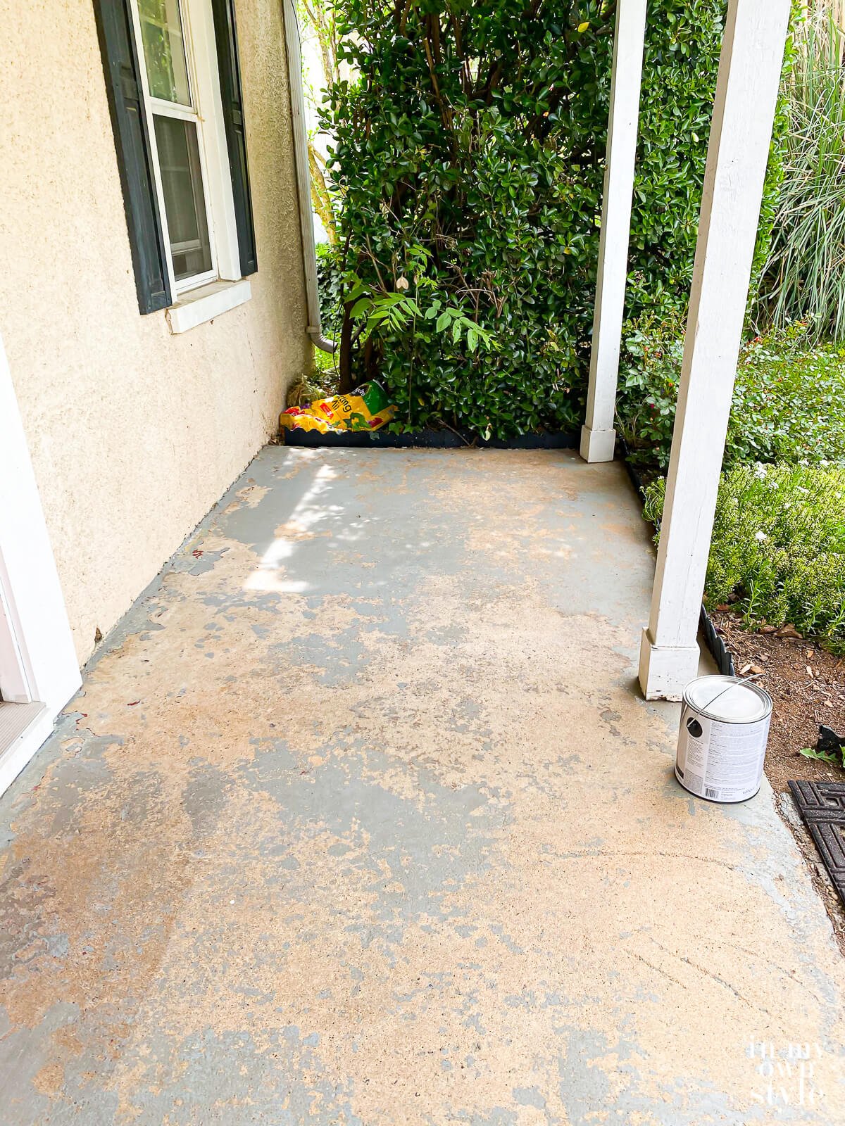 Worn and ugly concrete porch before getting a makeover