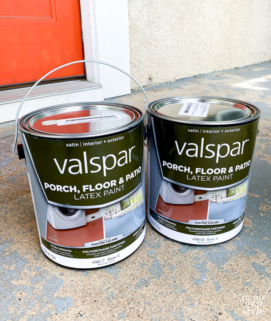 Valspar Porch Floor and Patio Latex Paint Gallons sitting on worn porch floor.