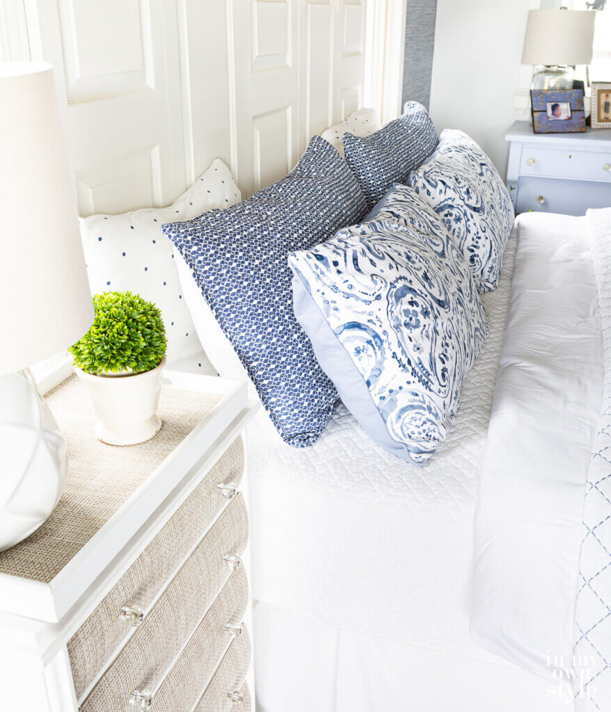 How to style pillows on a bed when mixing and matching bedding in your bedroom. 