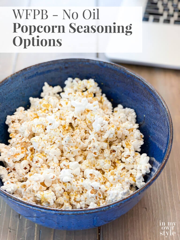 Bowl of No Oil Air popped popcorn with plant based seasoning on it. Text overlay says WFPB No Oil Popcorn Seasoning Options