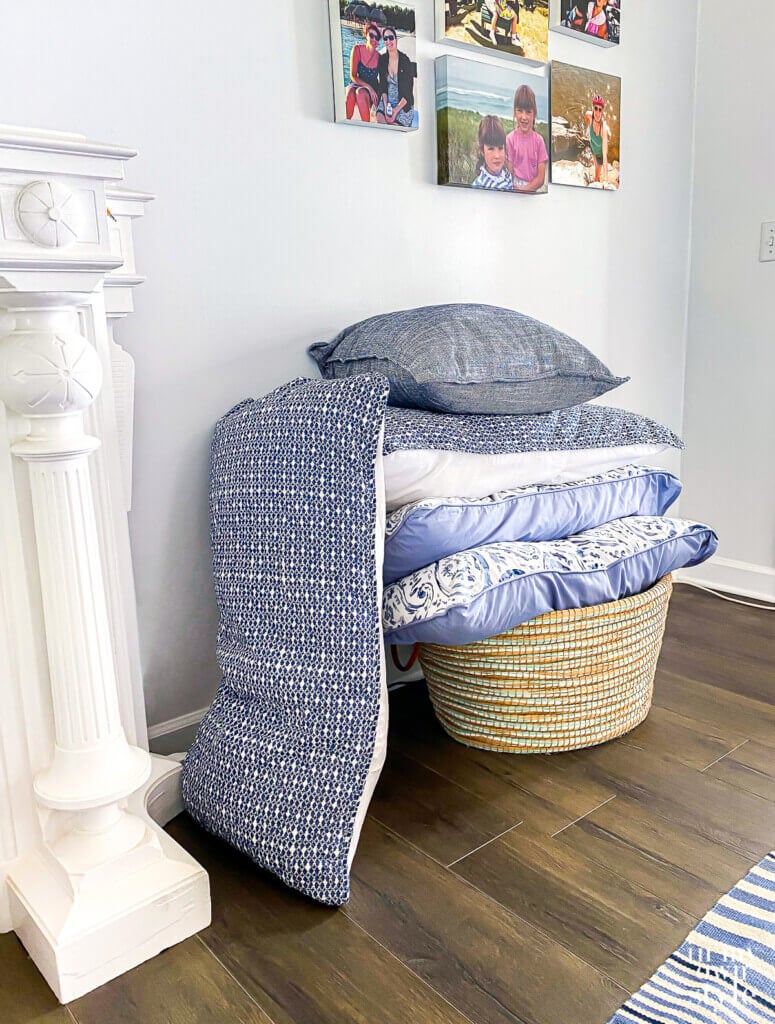 Where to put decorative pillows when sleeping. In a large floor basket.