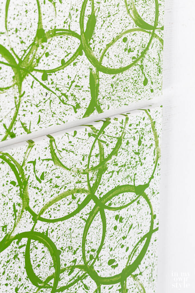 Close up of DIY modern art canvas using a paint can.