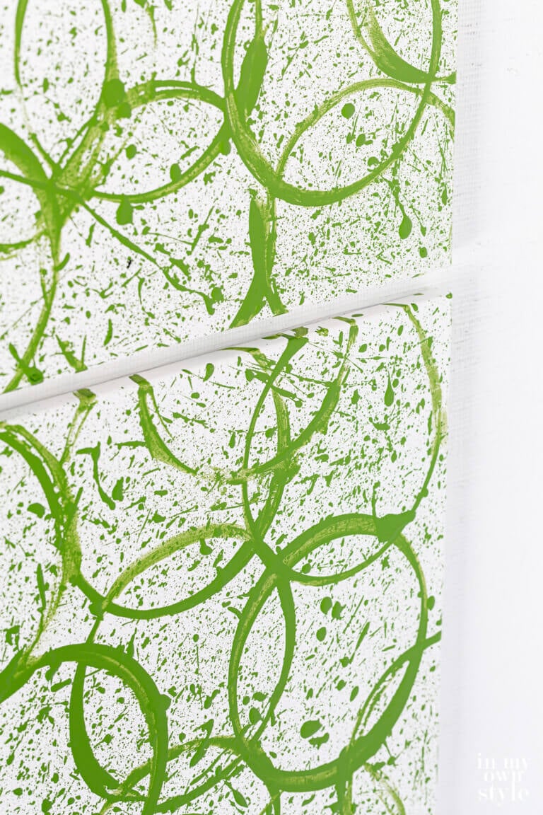 Close up of DIY modern art canvas using a paint can.