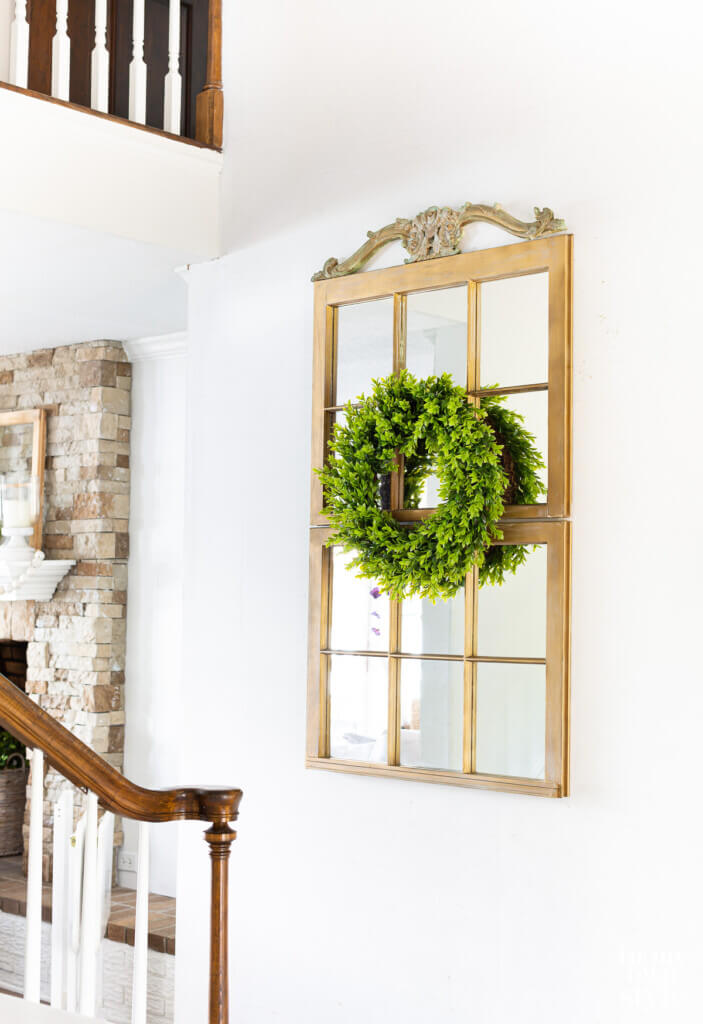 Make a decorative mirror using two old wood window frame sashes.
