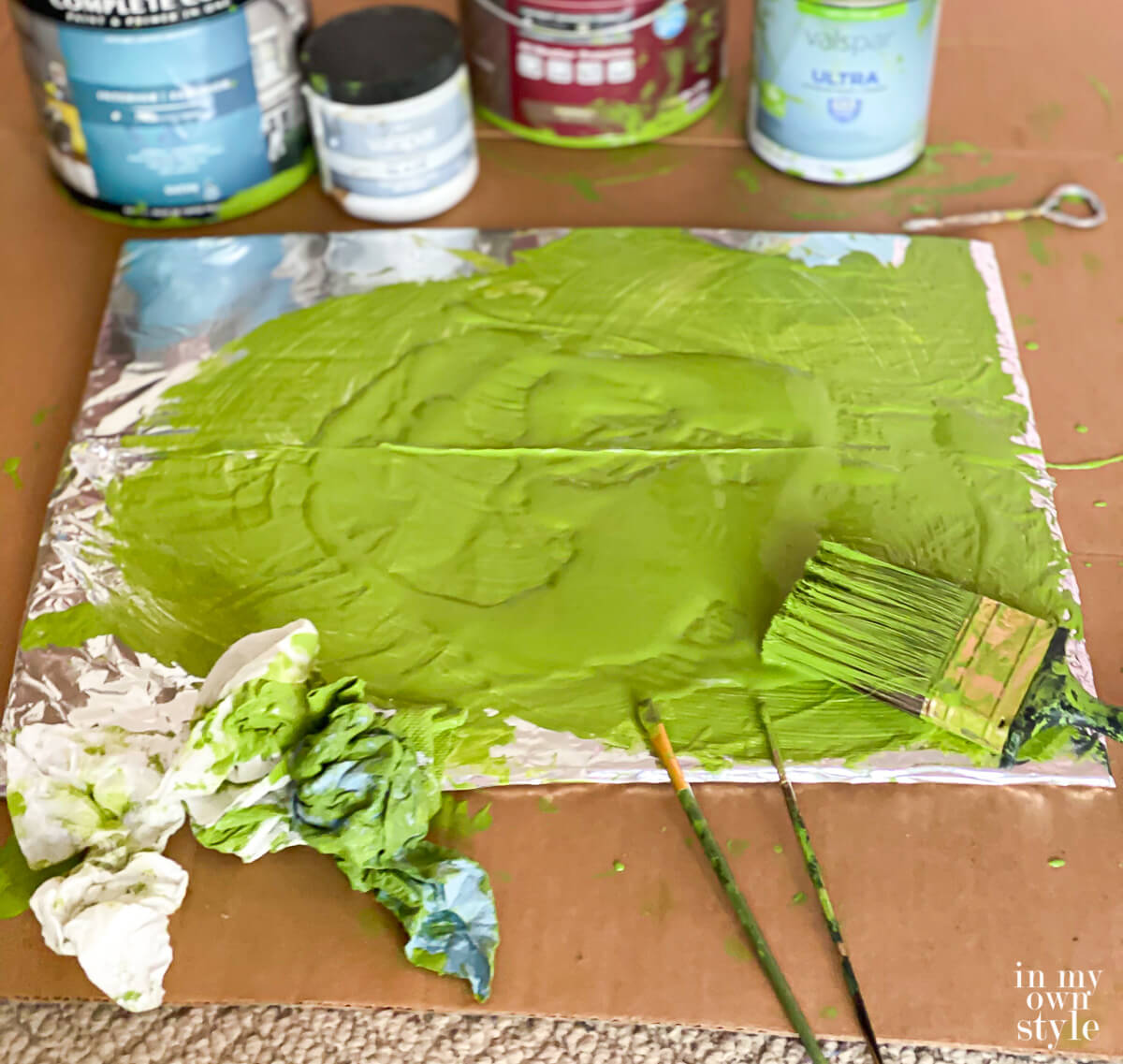 Paint palette made on a piece of cardboard covered with foil.