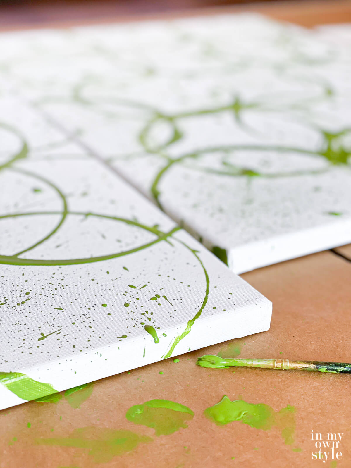 Close up of how to paint the sides of the canvas when making your own modern wall art.
