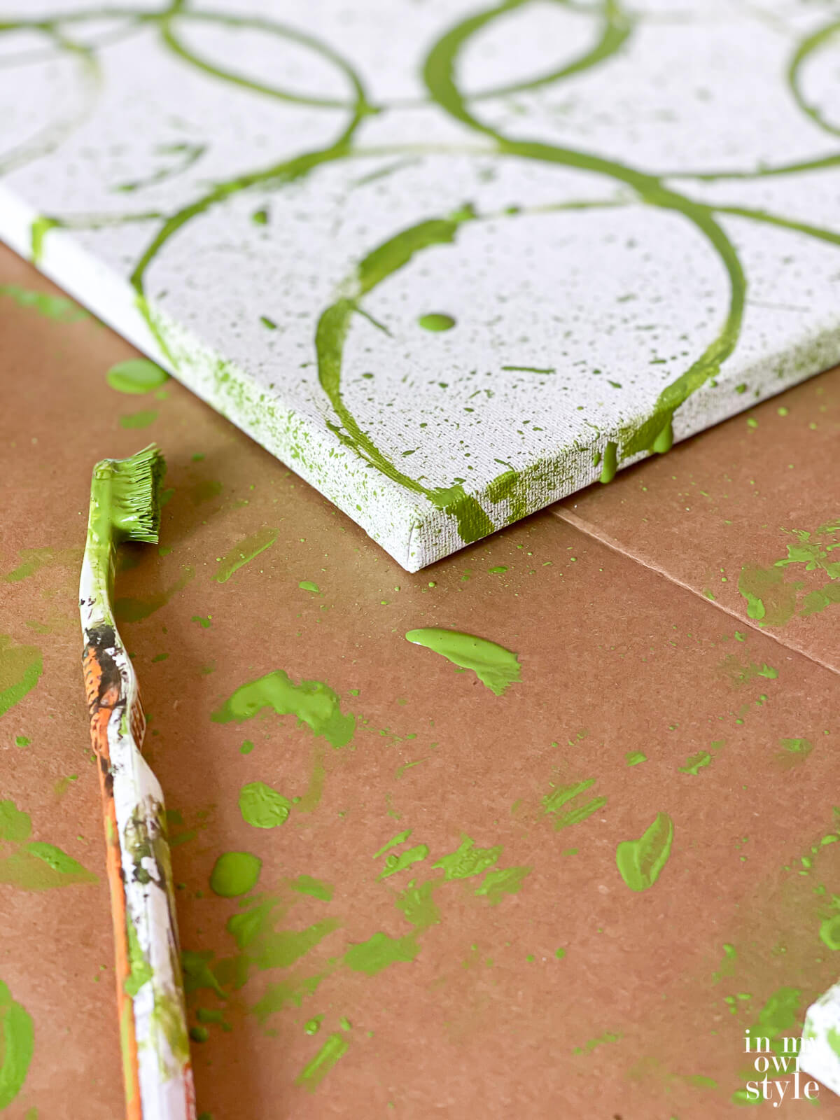 Splatter paint technique to create your own modern wall art on a canvas.
