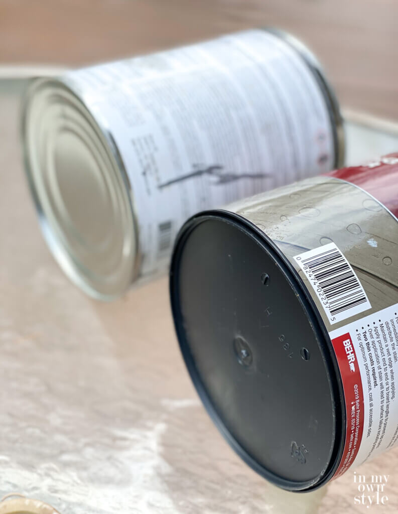 Bottom rims of gallon paint cans. One is metal, the other plastic.