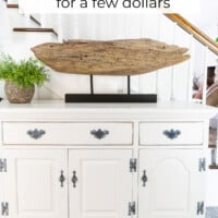 Make your own modern art using driftwood to make a table top display stand for it.