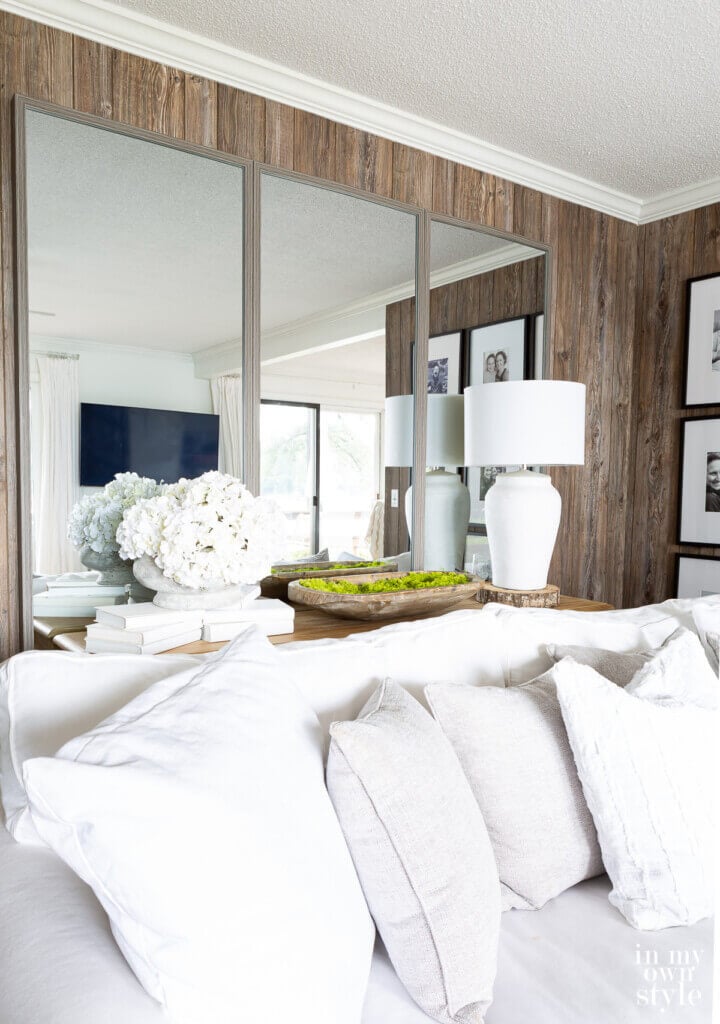 Floor mirrors hung on a living room wall.