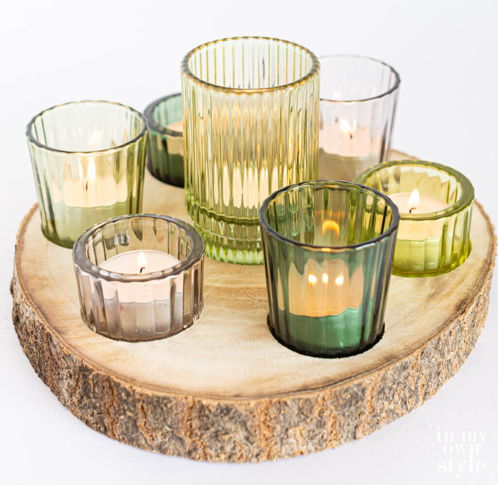 DIY tea light holder using a wood slice from a tree.
