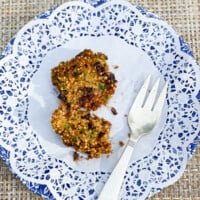 An oil-free zucchini muffin with a fork on a plate.