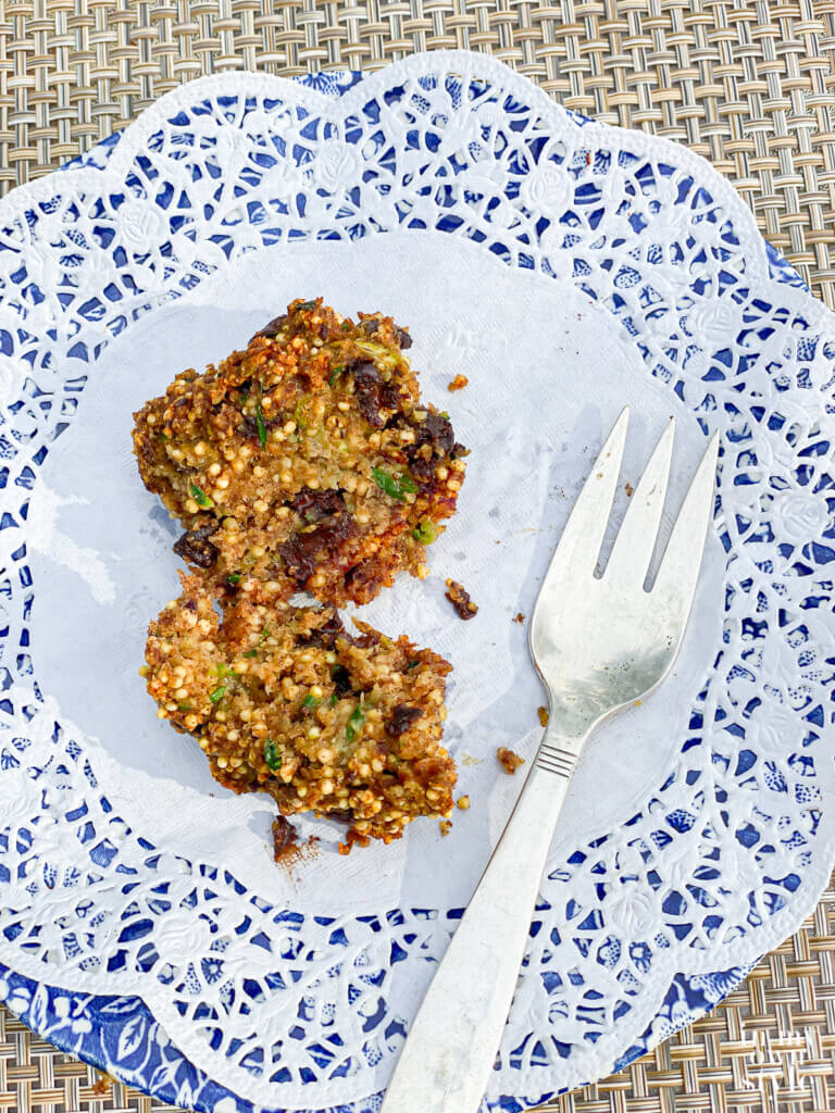 Guilt free chocolate chip zucchini muffins on a plate.