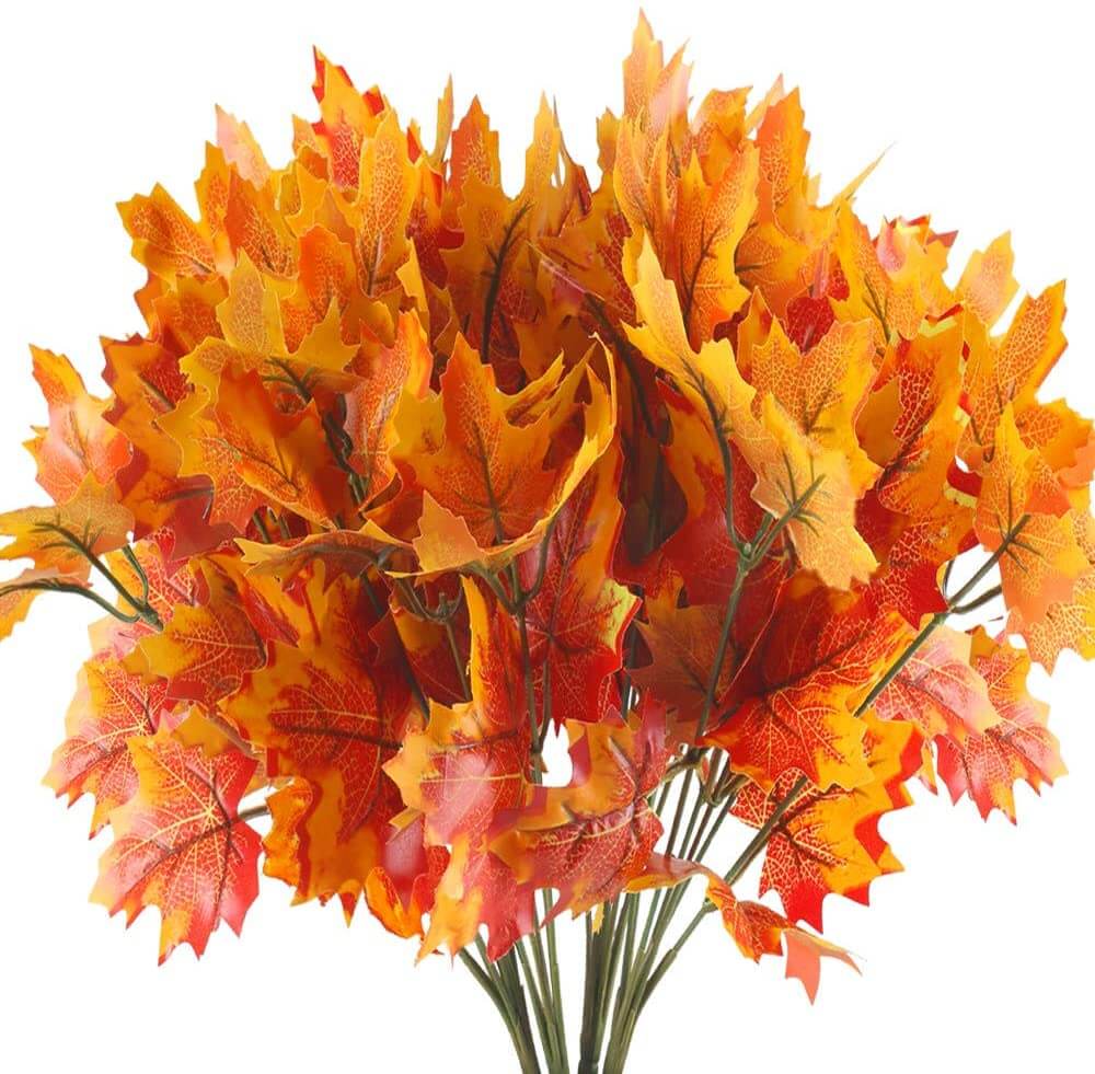 A bundle of brightly colored orange and yellow fall leaf stems.