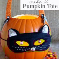 A foam pumpkin carved into a jack-o-lantern for Halloween. Black cat mask and handles were added to make into a trick-or-treating candle tote.