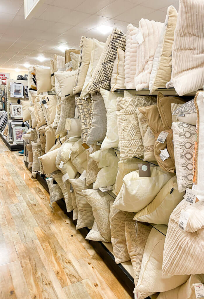 Neutral color throw pillows on display at Home Goods