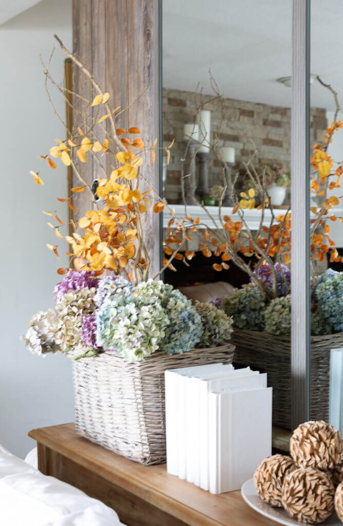 Dried hydrangeas in a basket for cozy living room for fall.