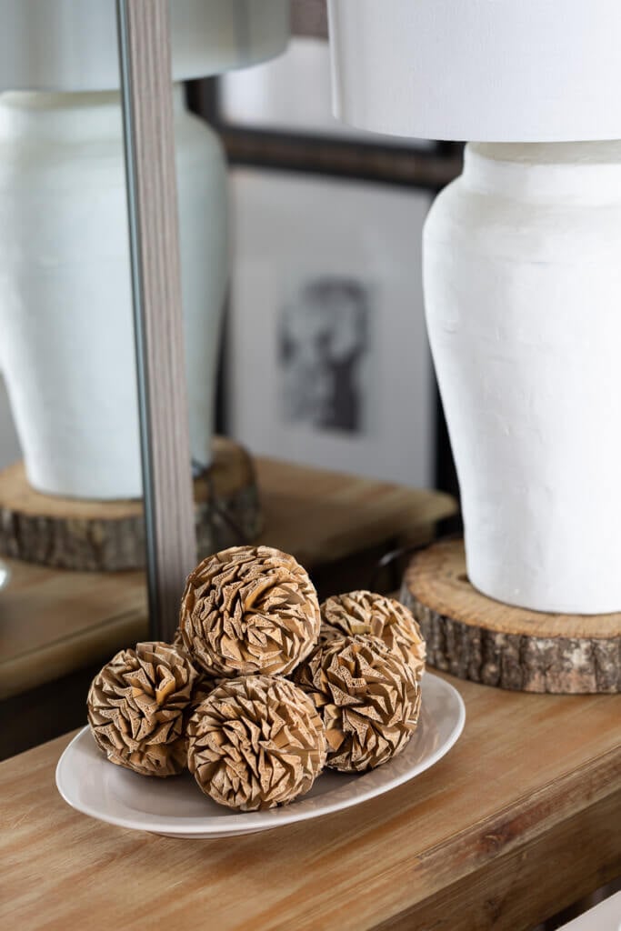 pictures of cozy homes - pinecone balls on a table.