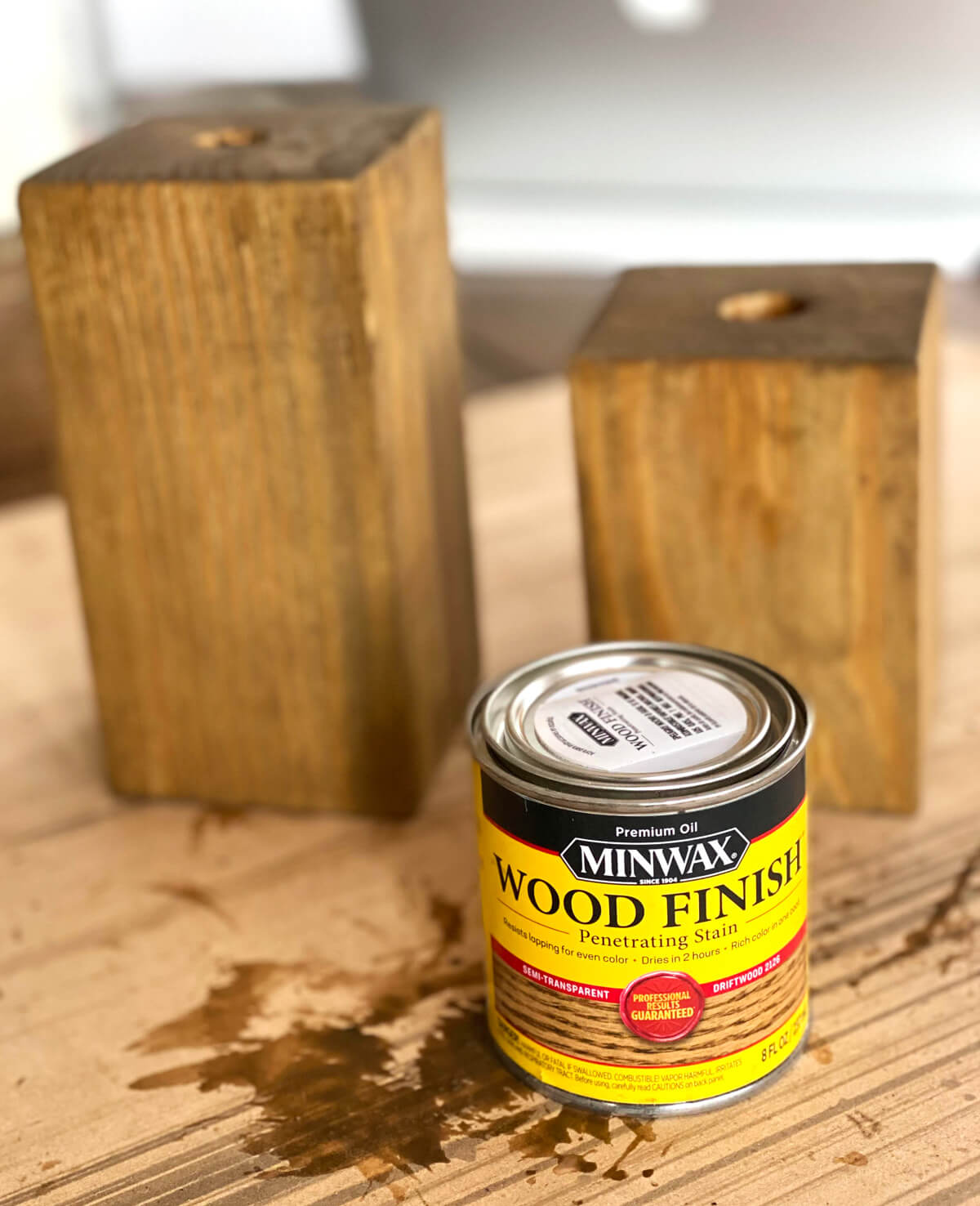 4 x 4 wood post scraps stained and holes drilled. Minwax wood finish stain can.