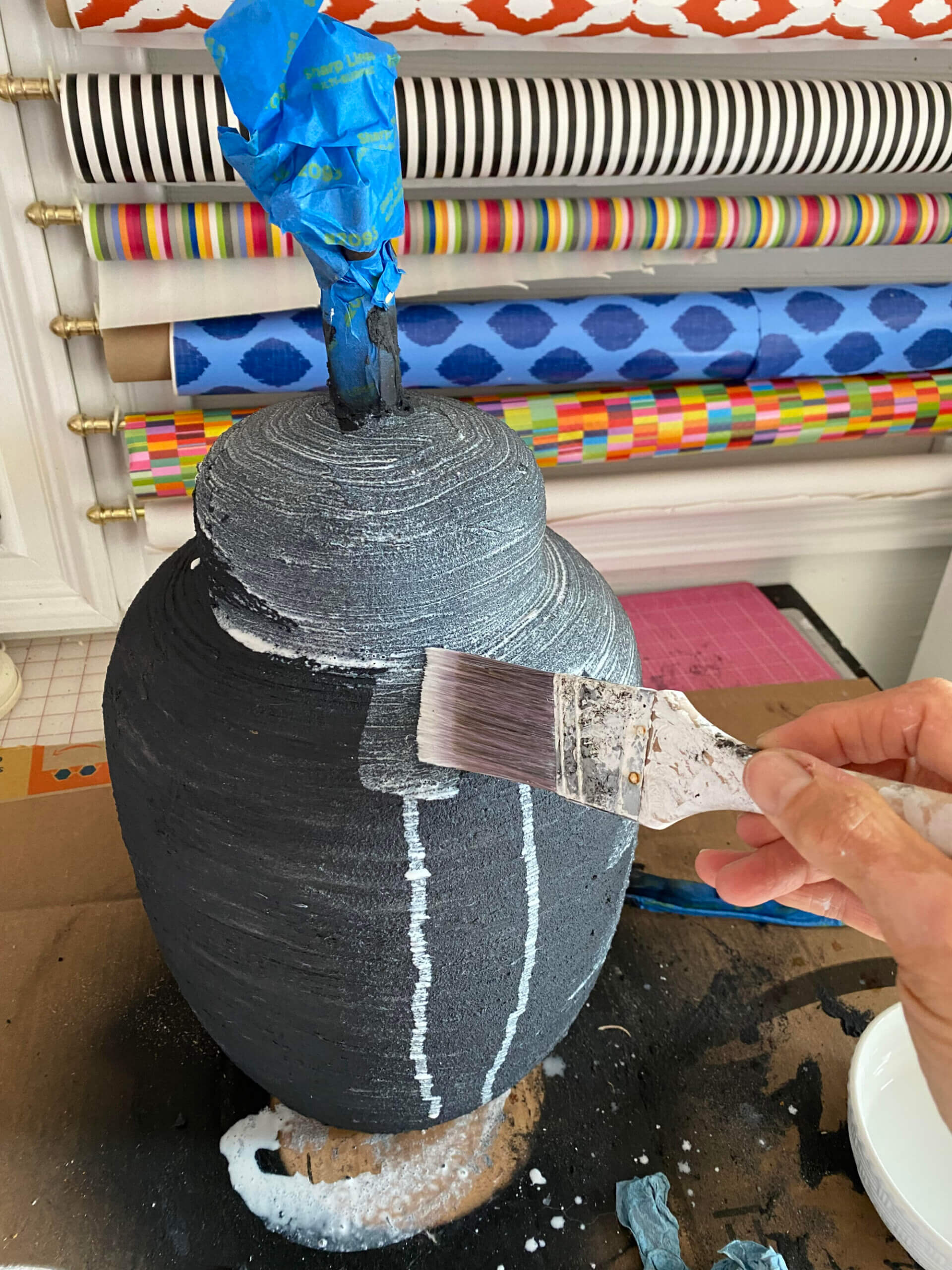 Whitewashing over textured black painted lamp base.