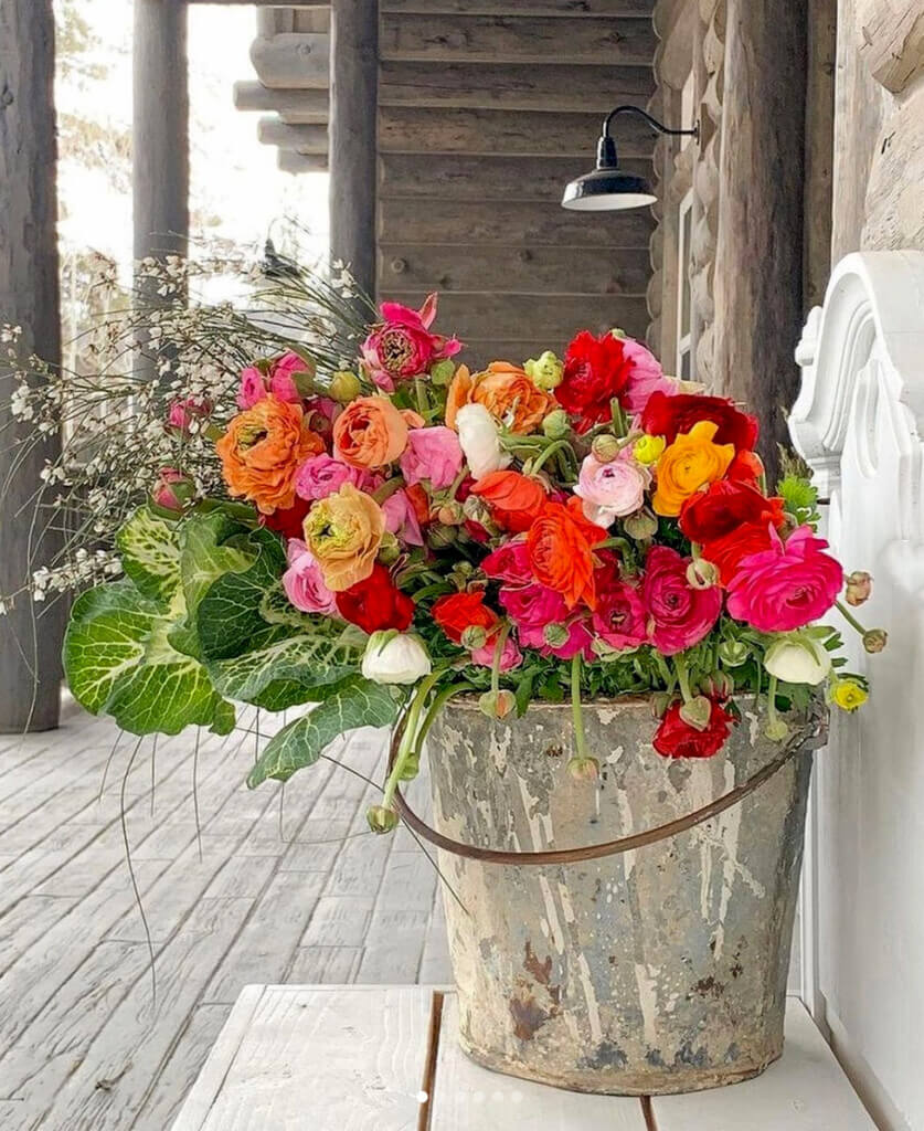 pretty flowers in rustic setting on porch.