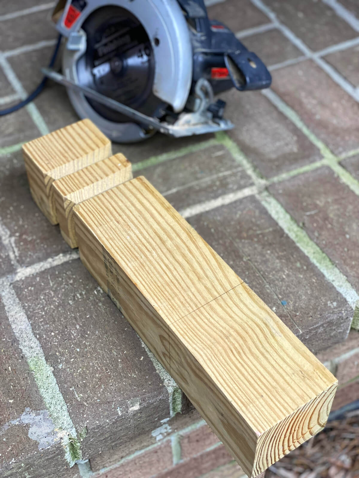 4 x 4 wood post scrap readied to be cut to make DIY wooden candle holders