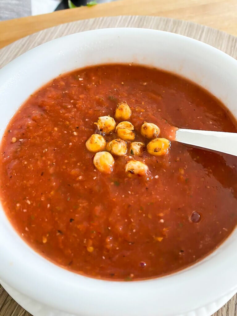 Chickpea croutons in a bowl of tomato soup