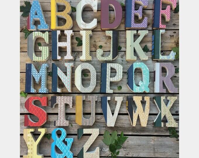 Crafts with old books like these Reader's Digest Condensed Books made into decorative letter art.