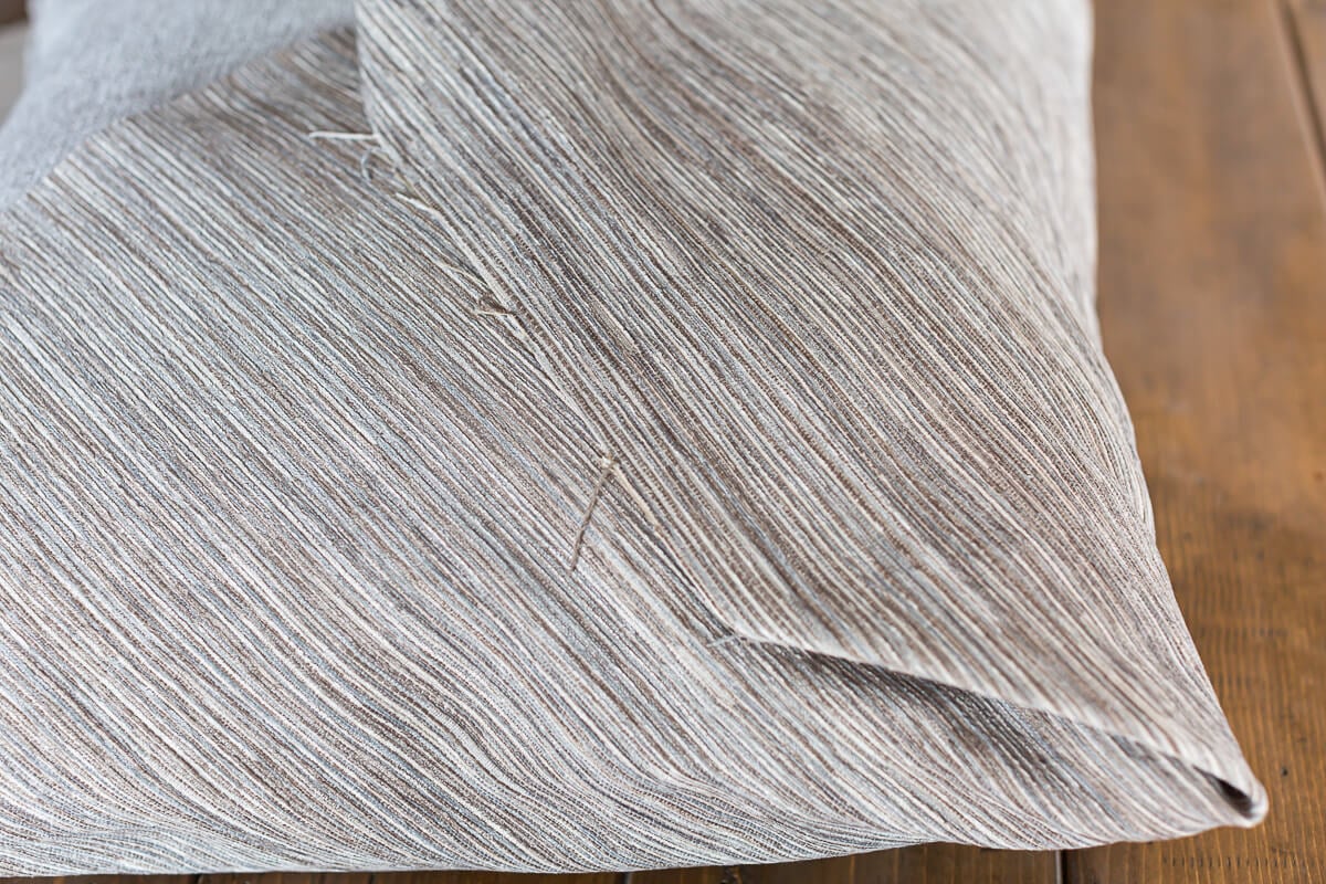 raw edge on fabric wrapped pillow