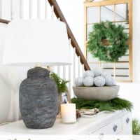 Modern Christmas decorating ideas in an entryway - Black, white and gold accents.