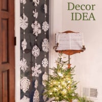 DIY Paper Snowflakes hanging in a window.