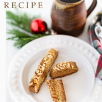 2 vegan gingerbread biscotti on a plate and coffee