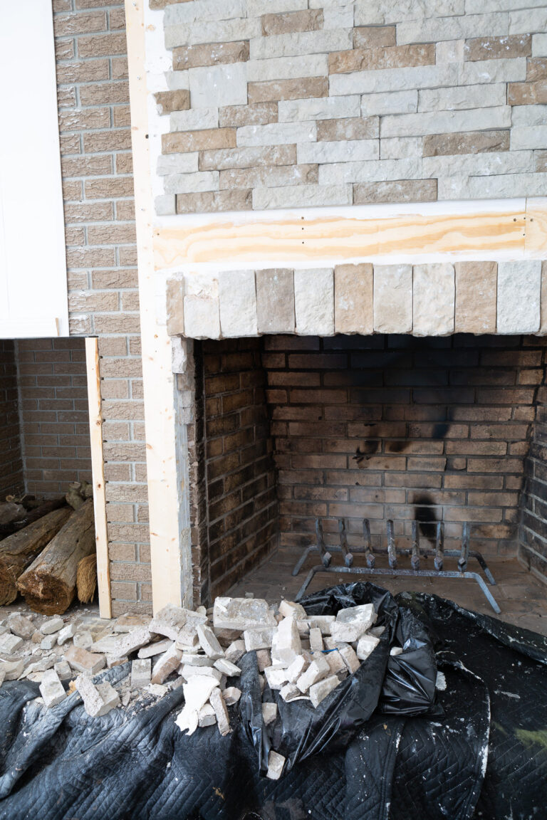 Stone surround around fireplace being removed