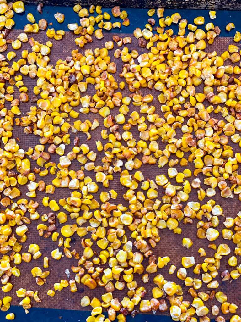 roasted corn kernels on a baking tray right out of the oven.