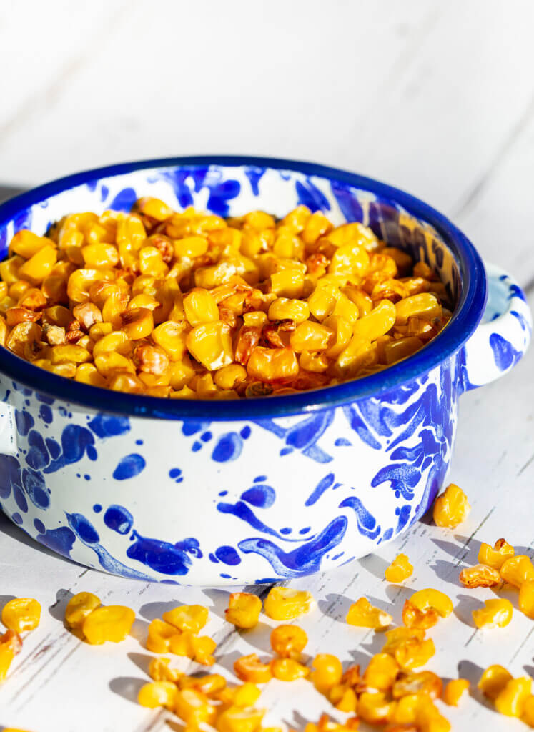 Roasted corn in a blue and white ramekin 