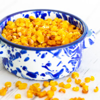 roasted corn in a blue and white ramekin make a healthy snack for dieters.