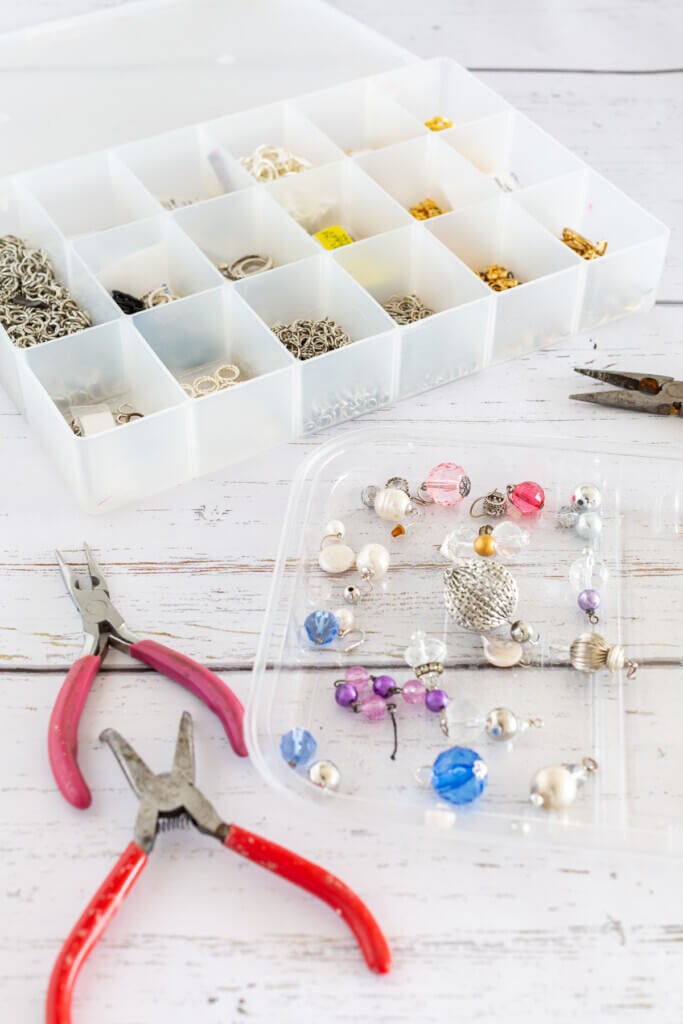 earring making supplies and tools on tray and in a storage box