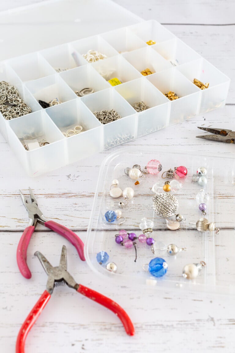 earring making supplies and tools on tray and in a storage box