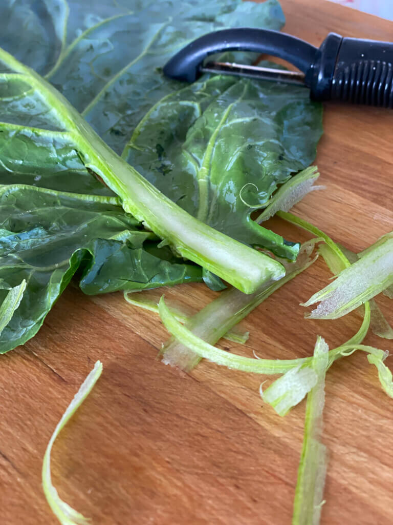 How to make a collard green leaf easy to roll into a wrap sandwich - use a vegetable peeler.