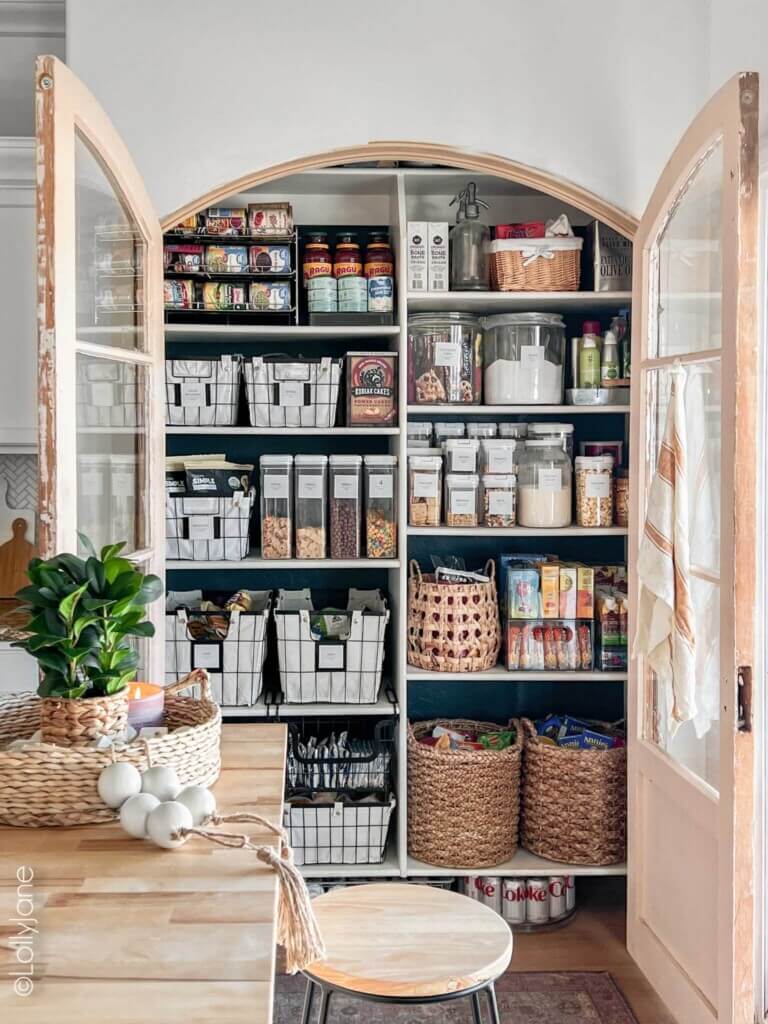 a pantry with arched glass doors