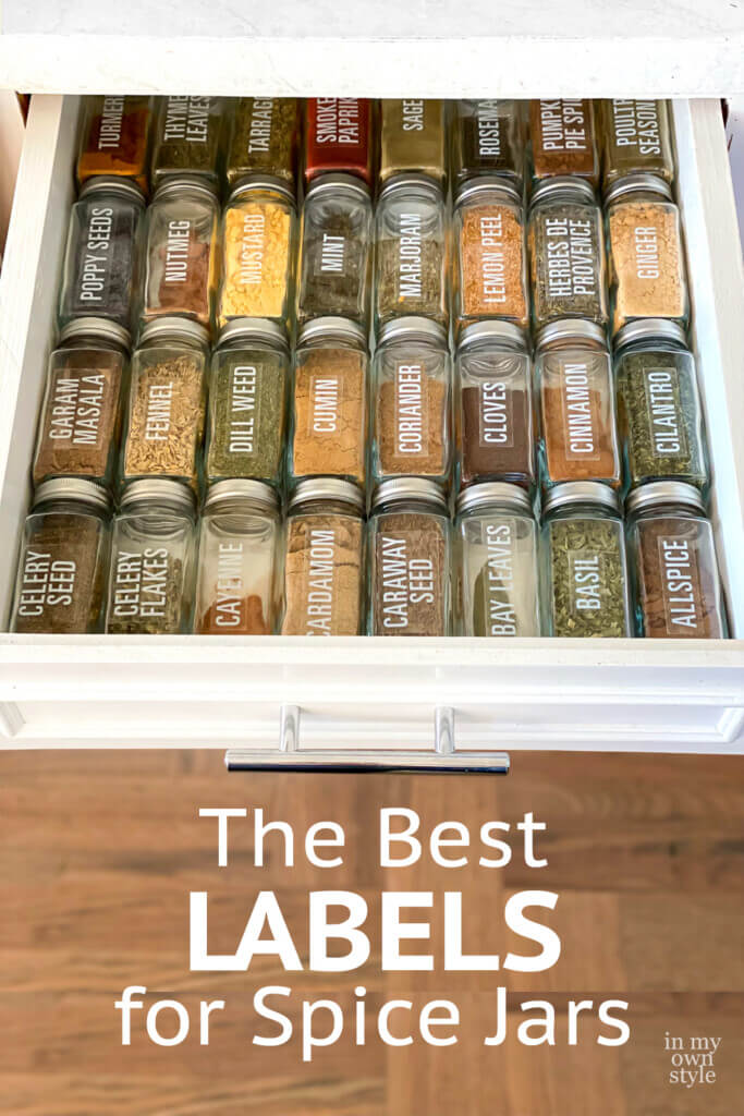 glass spice jars with labels in a drawer