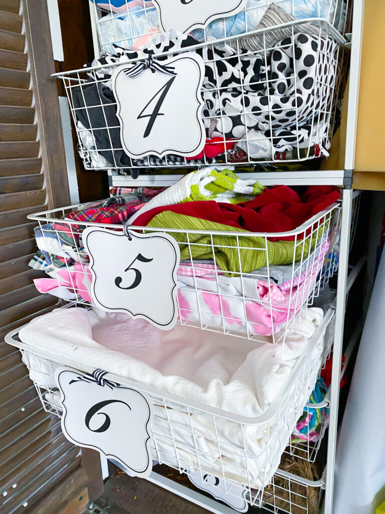 Leftover fabric scraps in wire drawers in craft stash.