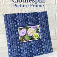 blue painted clothespins made into a photo frame.