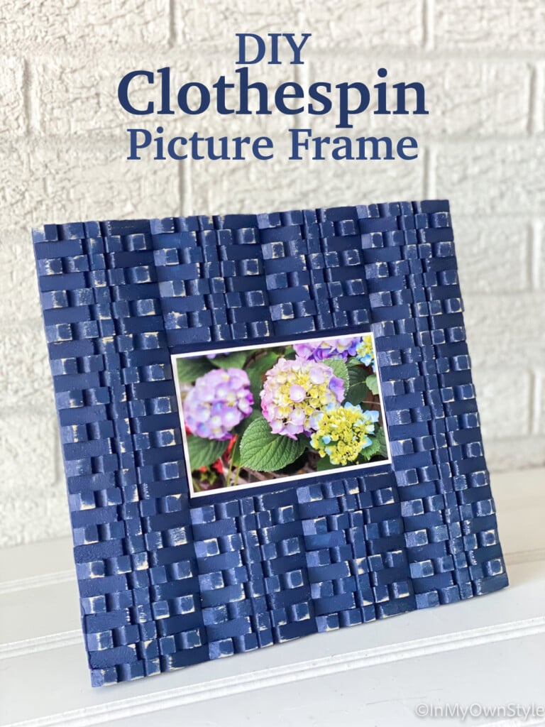 blue painted clothespins made into a photo frame.