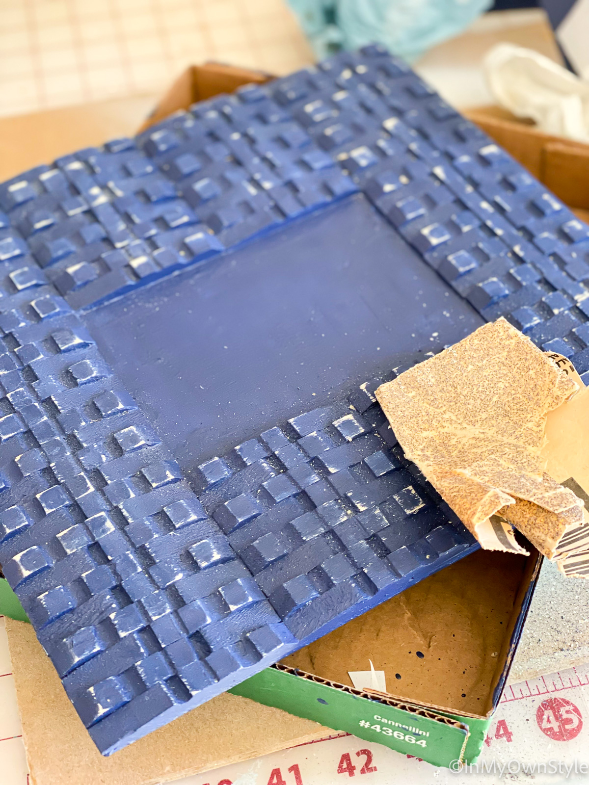 sanding painted clothespin picture frame