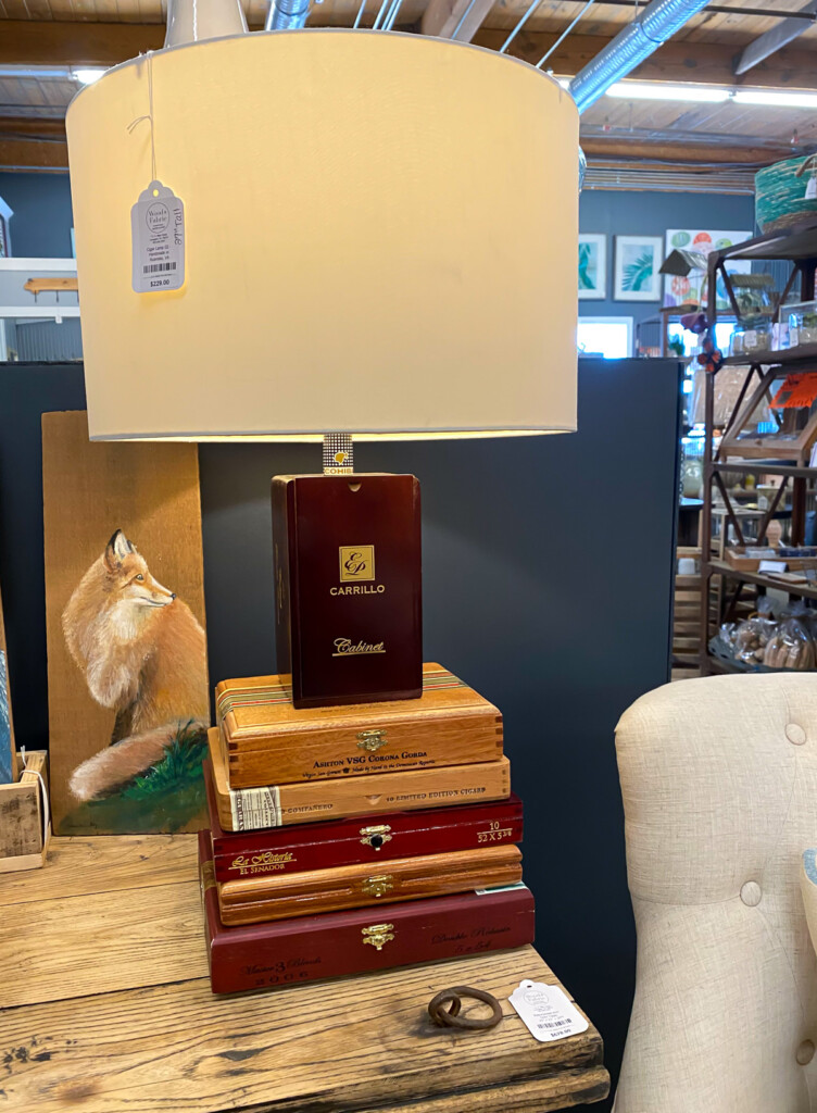 Lamp base made of cigar boxes.
