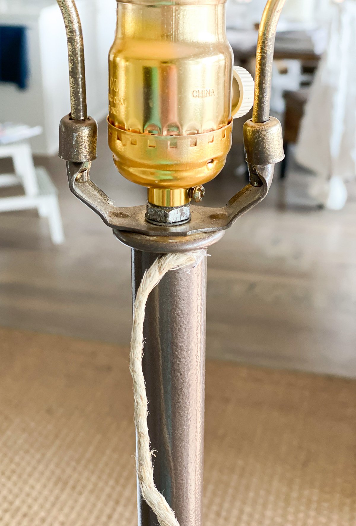 how to start wrapping hemp cord around base of floor lamp to give it a DIY coastal decor makeover