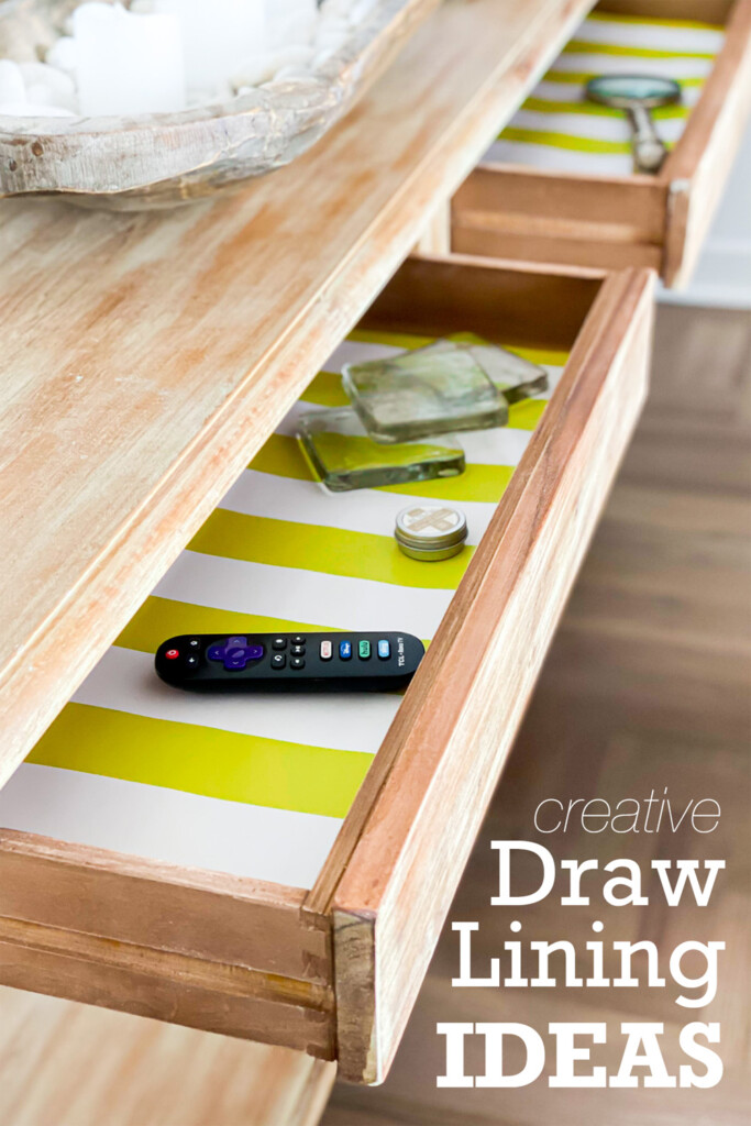 wood console table with green and white striped drawer liners
