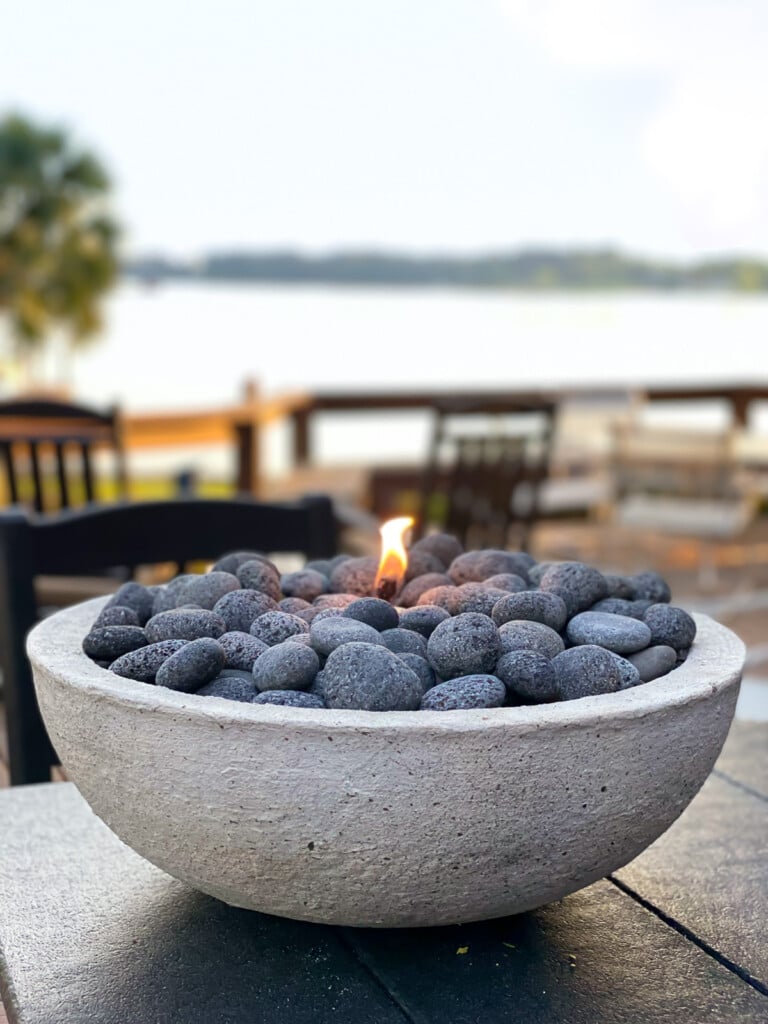 DIY tabletop fire bowl on table made in minutes by putting together a few basic items.